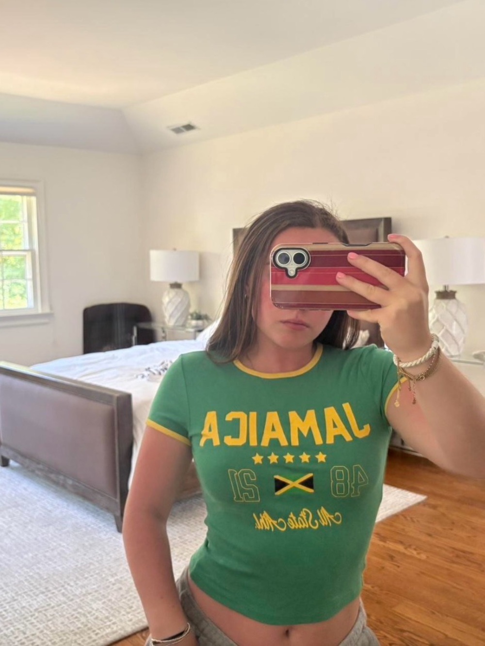 Bershka green Jamaica crop top with yellow text and flag graphic